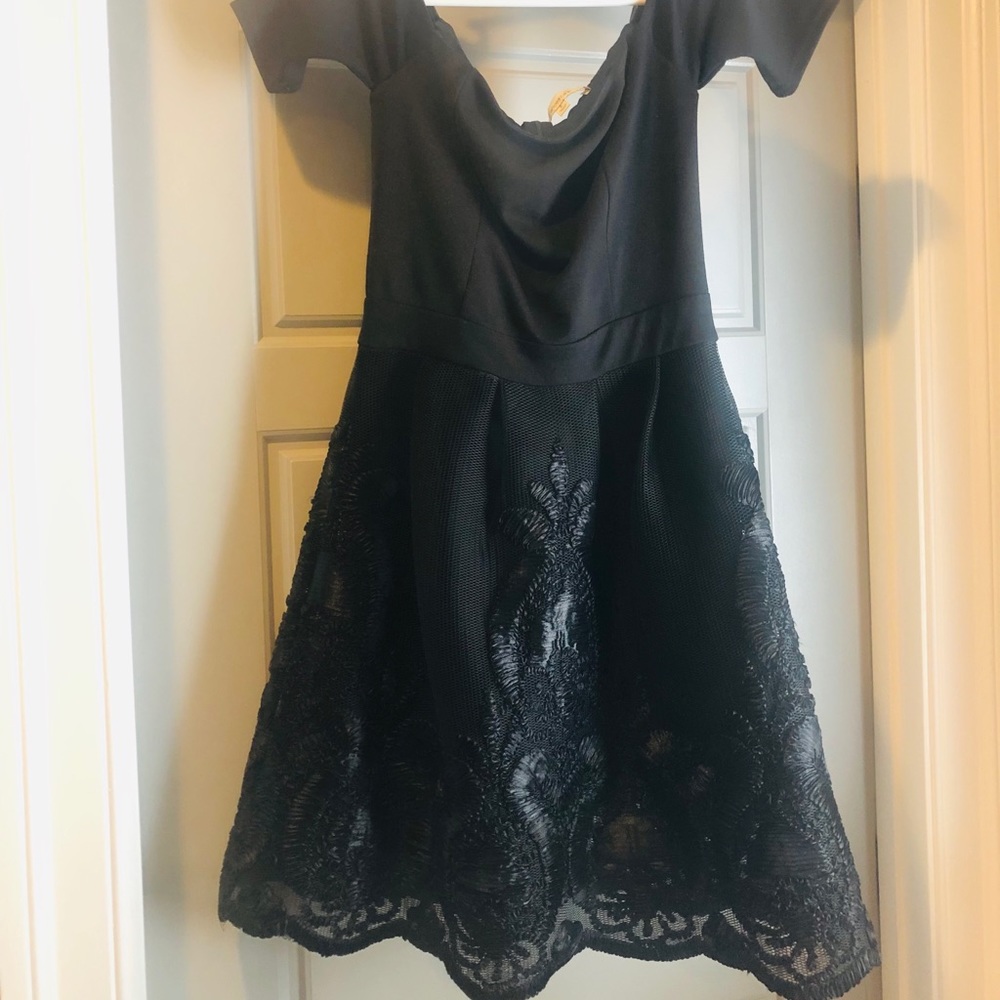 Off the shoulder black dress with full skirt